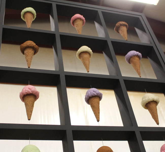 Ice cream display for Cream & Sugar in the ZENTX workshop, showing artificial ice cream cones suspended between segments of the frame