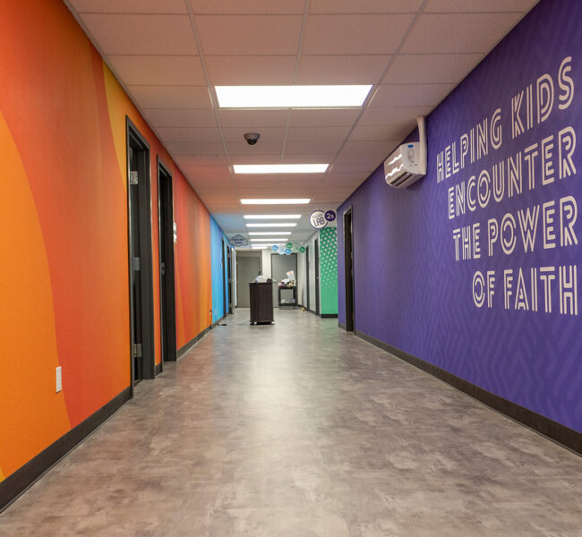 Hallway at Christian Celebration Center, showing orange, blue, and purple wallpapers